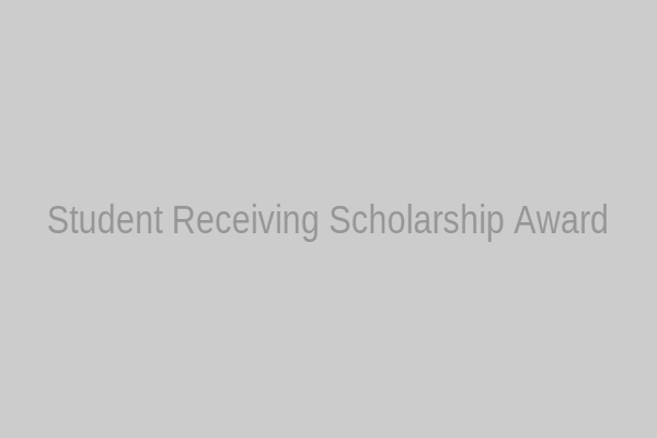 Student receiving scholarship award