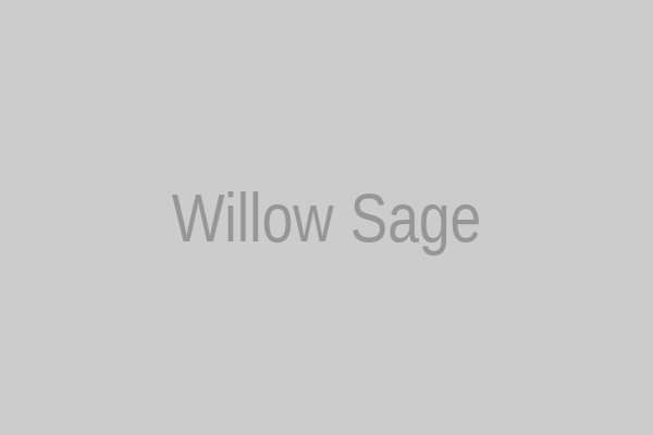 Willow Sage in a cozy hipster sweater with vintage glasses